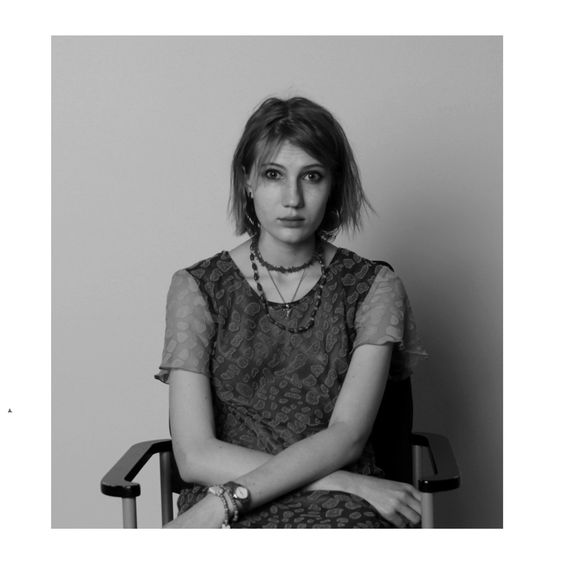 Black and white portrait of a student in a lace dress