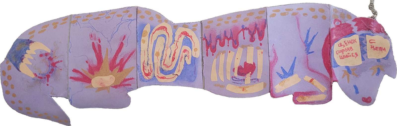 Dog-shaped accordion book painted with bursts of red and blue
