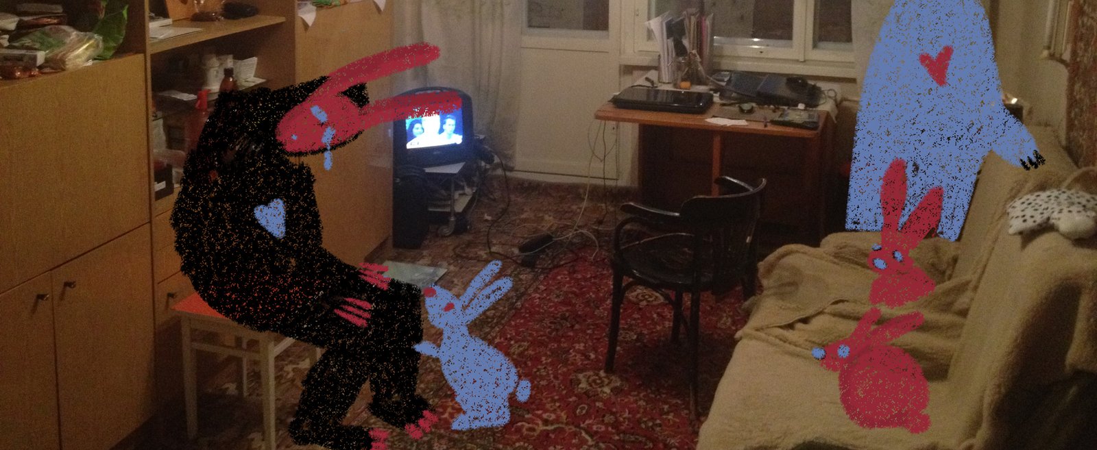 Living room photograph overpainted with stencil dogs and rabbits in black, blue and red